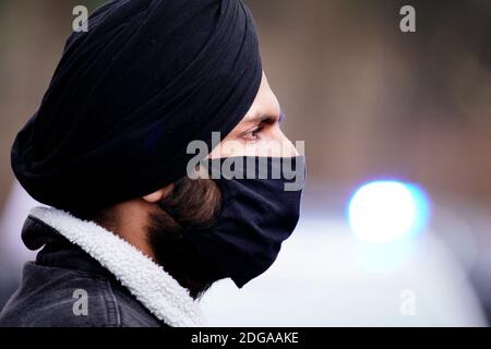 A man wearing a dastar is seen at a rally in support of Indian farmers in Warsaw, Poland on December 8, 2020. Several dozen people carried slogans on Stock Photo