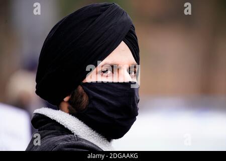 A man wearing a dastar is seen at a rally in support of Indian farmers in Warsaw, Poland on December 8, 2020. Several dozen people carried slogans on Stock Photo