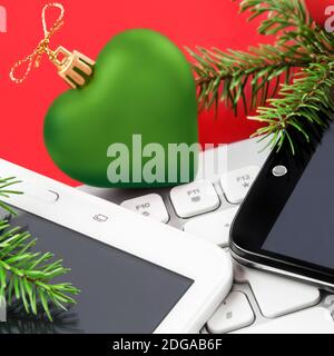 Christmas Time with mobile, PC keyboard and tablet Stock Photo
