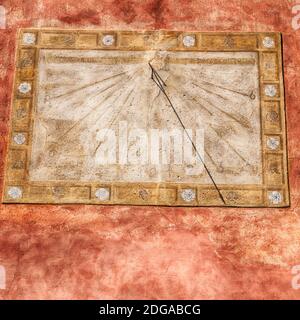 In italy sundial and   antique  wall Stock Photo