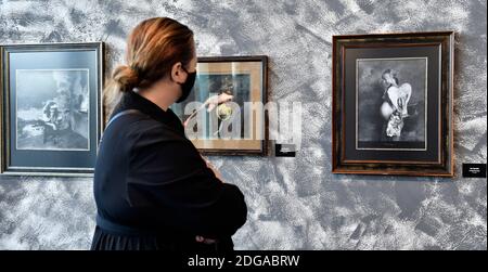 Zlin, Czech Republic. 08th Dec, 2020. A woman looks at a photographs by Czech photographer Jan Saudek at the opening of the exhibition of his 85 pictures due to his 85th birthday in Zlin, Czech Republic, December 8, 2020. Credit: Dalibor Gluck/CTK Photo/Alamy Live News Stock Photo