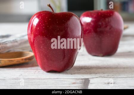 beautiful red apple on white kitchen table background Stock Photo