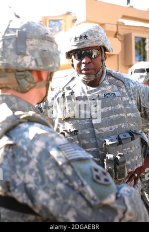 U.S. Army Lt. General Lloyd J. Austin III, right, commanding general, Multi-National Corps Iraq, visits with members of the 1st Battalion, 68th Infantry Regiment at Combat Outpost War Eagle December 11, 2008 in Adhamiyah, Iraq. Stock Photo