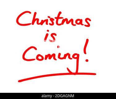 Christmas is Coming! handwritten on a white background. Stock Photo