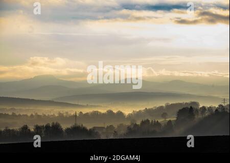 Fulda, Germany. 08th Dec, 2020. View from the district Dietershan at sunrise to the heights of the 'Naturpark Hessische Rhön'. Credit: Andreas Arnold/dpa/Alamy Live News Stock Photo