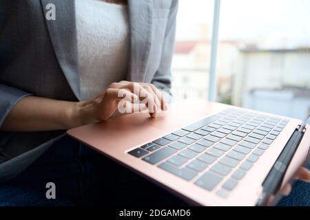 female hand writing on laptot Stock Photo