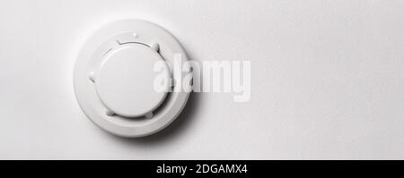 Close-up Of White Smoke Detector On A Ceiling Stock Photo