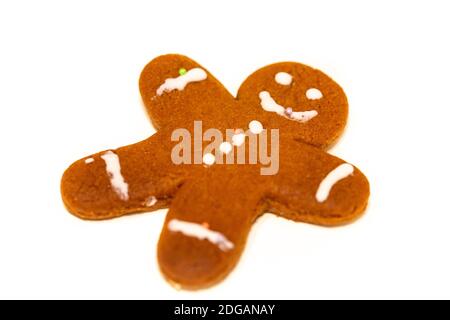 A gingerbread man made by a child isolated on a white background Stock Photo