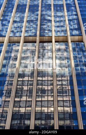 The reflex of the skyscraper in the window Stock Photo