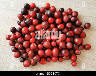 Fresh red cranberries on a wooden table Stock Photo