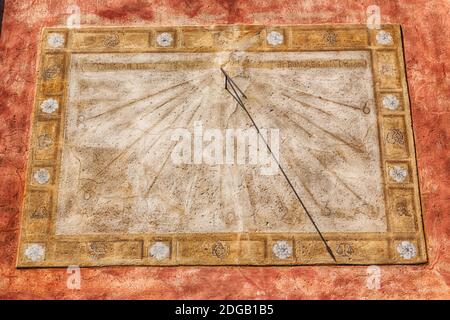 In italy sundial and   antique  wall Stock Photo