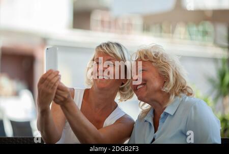 Moms making a selfie Stock Photo - Alamy