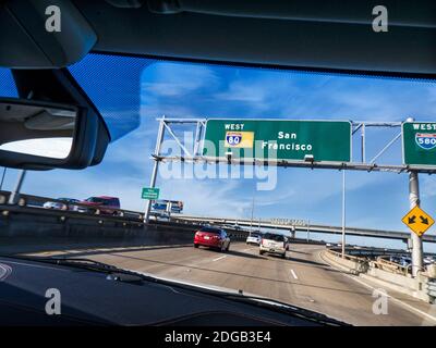 i80 DRIVING SAN FRANCISCO Interstate 80 road sign car driver viewpoint driving along Interstate 80 West Highway with Interstate 80 sign for San Francisco California USA Stock Photo