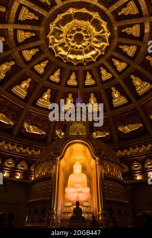 A pink Buddha statue at the top of the Bai Dinh Pagoda, in the homonymous buddhist temple complex in Ninh Binh province, Vietnam Stock Photo