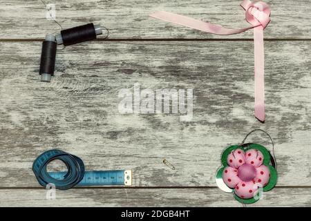 Buttons, ribbon , thread and needles for sewing Stock Photo