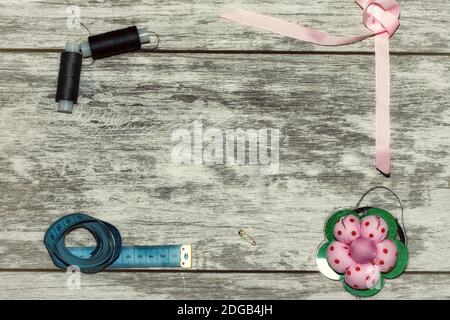 Buttons, ribbon , thread and needles for sewing Stock Photo