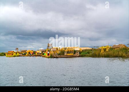 View of Floating Islands of Uros with Uru or Uros people and Reed Boats Stock Photo