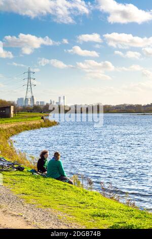 Couple of women taking at East Warwick Reservoir, Walthamstow Wetlands, Lea Valley Country Park, London, UK Stock Photo