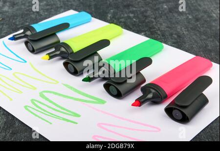 Multi-colored felt-tip pens on a sheet of paper, close up, shallow depth of sharpness Stock Photo