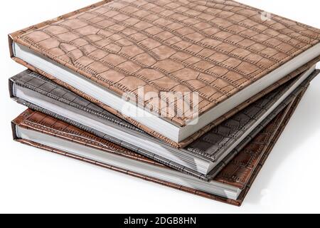 Hardcover books lying on a white background Stock Photo
