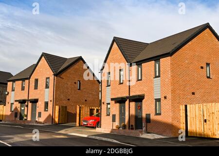 Cardiff, Wales - December 2020: Exterior view of semi-detached houses on a new housing development on the outskirts of Cardiff. Stock Photo