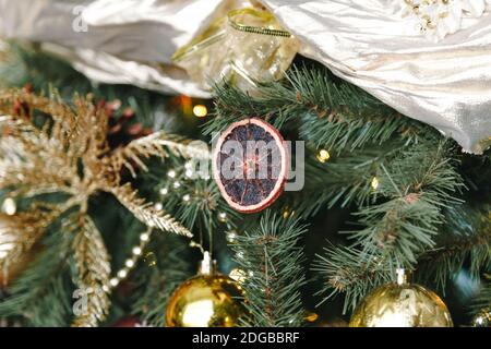 Dried orange slice on as decoration on Christmas, New Year tree. Close up view Stock Photo