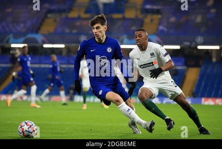 Chelsea's Kai Havertz and FC Krasnodar's Fernando Kaio (right) battle for the ball during the Champions League match at Stamford Bridge, London. Stock Photo