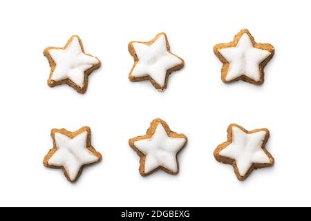 Icing gingerbread stars. Traditional Christmas cookies isolated on white background. Stock Photo