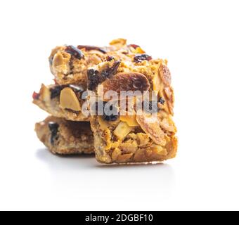Crunchy cereal cookies with nuts and raisins isolated on white background. Stock Photo