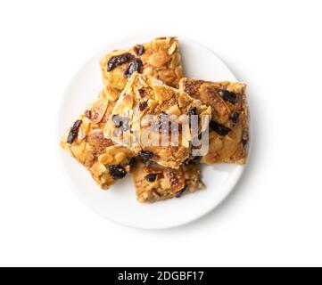 Crunchy cereal cookies with nuts and raisins isolated on white background. Stock Photo
