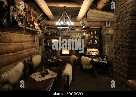 View of an old wooden and stone highlander chamber with a fireplace Stock Photo