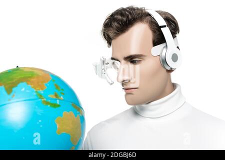 Cyborg in headphones and digital eye lens looking at globe on blurred foreground isolated on white Stock Photo