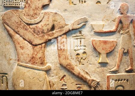 Ancient egypt scene. Colored Hieroglyphic carvings on the wall. Murals ancient Egypt. Stock Photo