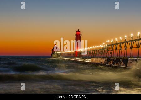 Lighthouse on the jetty at dusk, Grand Haven South Pierhead Inner Lighthouse, Lake Michigan, Grand Haven, Ottawa County, Michigan, USA Stock Photo