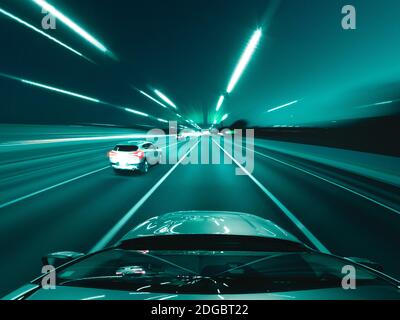 Car driving along a motorway at night, USA Stock Photo