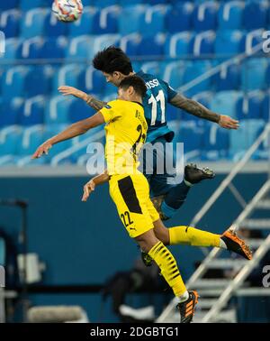 SAINT PETERSBURG, RUSSIA - DECEMBER 08: Sebastián Driussi of Zenit St. Petersburg and Jude Bellingham of Borussia Dortmund compete for a header during the UEFA Champions League Group F stage match between Zenit St. Petersburg and Borussia Dortmund at Gazprom Arena on December 8, 2020 in Saint Petersburg, Russia.  (Photo by MB Media) Stock Photo