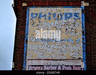 Old advert or ghostsign for the electrical company Phillips dating from the 1970s, in Tolworth, south west London. Stock Photo