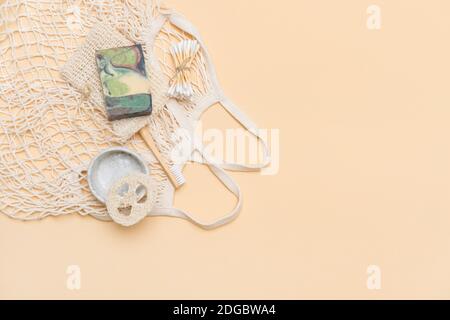 Zero waste bathroom accessories on camel color background. Natural eco bamboo product. Plastic free beauty essentials. Stock Photo