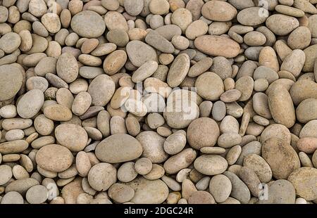 Stone river pebble beige gray natural background