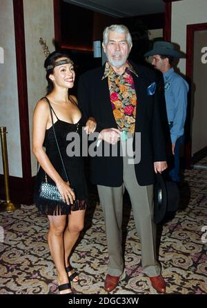 ARCHIVE: LOS ANGELES, CA. August 12, 1995: Actor James Coburn & Paula Murad at the Golden Boot Awards at the Century Plaza Hotel in Los Angeles. File photo © Paul Smith/Featureflash Stock Photo