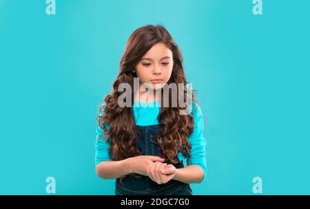 International childrens day. small kid fashion. Childhood happiness. small girl child with perfect hair. Happy little girl. Beauty and fashion. Funky style beauty. She is really cute. Stock Photo