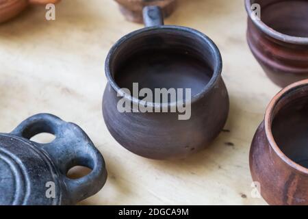 Dark brown and black clay pot, traditional country housewares close-up Stock Photo
