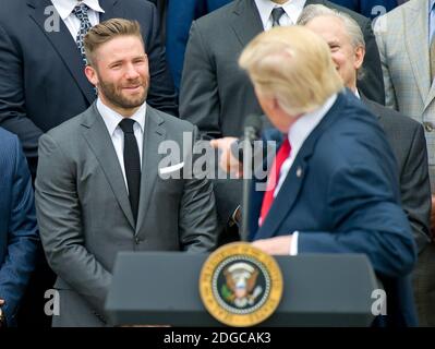 United States President Donald J. Trump gestures towards New England Patriots wide receiver Julian Edelman (11) as he makes remarks welcoming the Super Bowl Champion New England Patriots to the South Lawn of White House in Washington, DC, USA, on Thursday, April 19, 2017. Photo by Ron Sachs/CNP/ABACAPRESS.COM Stock Photo