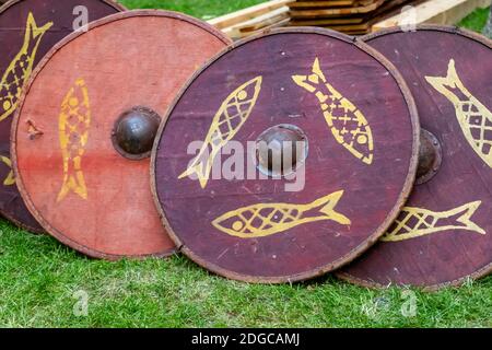 Set of traditional wooden shields, round red patterned fish, disposable for ostentatious fights Stock Photo