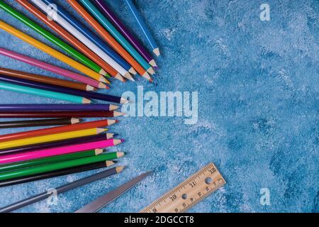 Back to school concept. Colored pencils, ruler, scissors Stock Photo