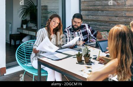 Group of people in a work meeting on the terrace of the office Stock Photo