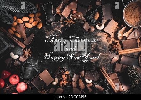 Merry Christmas and Happy New Year greeting post card wallpaper with text in frame festive ingredients of baking cookies Stock Photo