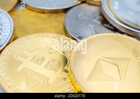Bunch of Crypto currency coins with focus on BTC Bitcoin Stock Photo