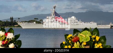 Honolulu, United States Of America. 07th Dec, 2020. Honolulu, United States of America. 07 December, 2020. U.S. Navy sailors aboard the guided-missile destroyer USS Michael Murphy man the rails as they sail pass the USS Arizona Memorial as part of the 79th Pearl Harbor Remembrance Day ceremony at the Pearl Harbor National Memorial December 7, 2020 in Honolulu, Hawaii. Credit: MC2 Jessica Blackwell/US Navy/Alamy Live News Stock Photo
