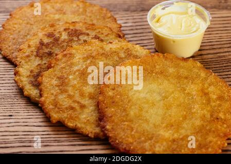 fried potato pancakes on a wooden Board Stock Photo